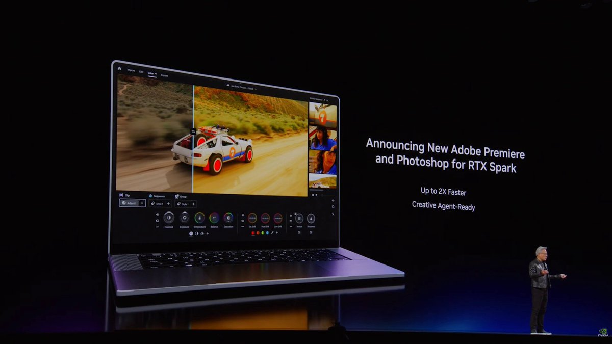 The image shows a laptop computer displaying an advertisement for Adobe Premiere and Photoshop for the new RTX Spark chip, which is being released by Adobe andNVIDIA. The laptop screen features a video of a car driving down a road with a person standing on top of it. There are also two other images displayed on the screen, one showing a car in motion and another featuring a person as well. A man can be seen standing next to the laptop, likely presenting or discussing the new software release. The background is dark, which contrasts with the bright colors used for the advertisement and makes the laptop screen stand out prominently.