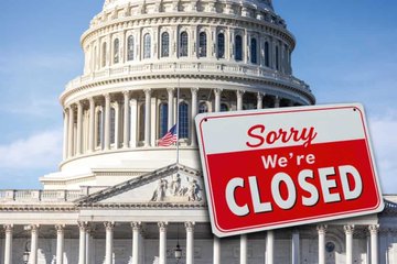 The image shows the U.S. Capitol building with a red and white "Sorry We're CLOSED" sign in the foreground, symbolizing a government shutdown. This visually reinforces the post's warning about a potential September shutdown that would halt key economic data, blinding the Federal Reserve and delaying rate cuts to the detriment of risk assets like crypto.