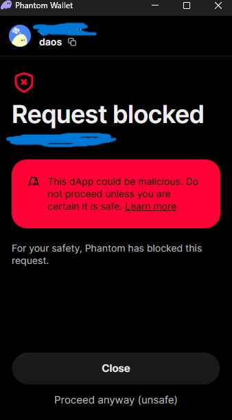 This Phantom Wallet pop-up shows a "Request blocked" warning because "This dApp could be malicious," which relates to the post's warning about new domains being unrecognized before verification.
