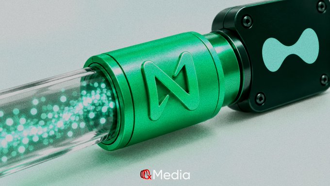 A 3D render of a green and black cylindrical device with an 'N' logo, emitting glowing green particles, branded 'RMedia'.