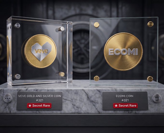 The image features a display case with two gold and silver coins placed inside. The coins are labeled "Ecomi Coin" and have the number "321". They appear to be valuable collectibles or rare items, as indicated by their placement in a glass display case. The background of the image is black, which contrasts with the shiny appearance of the coins.
