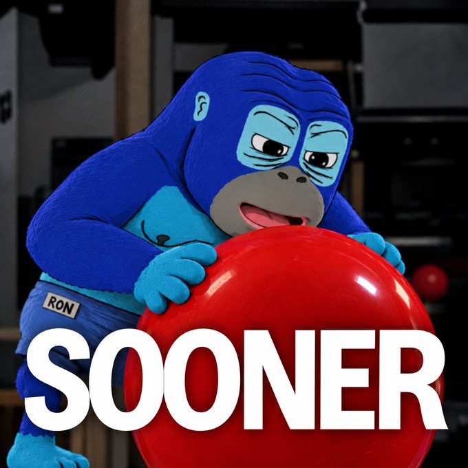 A blue gorilla mascot wearing a "RON" name tag holds a large red ball with the word "SOOONER" displayed prominently.