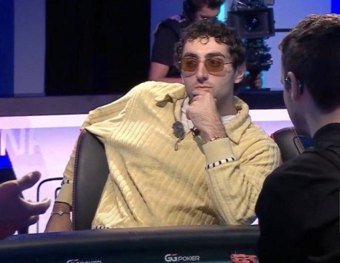 A poker player wearing sunglasses and a yellow sweater sits thoughtfully at a "GG POKER" table, appearing deep in contemplation with his hand on his chin, reflecting the post's reference to rasmr_eth making a risky "deal with the devil" bid of $jimothy at the start of the new year.