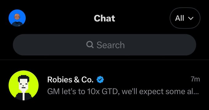 A dark-themed chat interface screenshot showing a message from "Robies & Co." that reads "GM let's to 10x GTD, we'll expect some al..." posted 7 minutes ago.