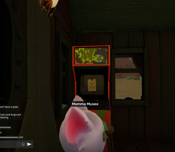 A screenshot from a video game showing a pink pony character looking at an arcade machine labeled 'Momma Musee' in a dimly lit room.