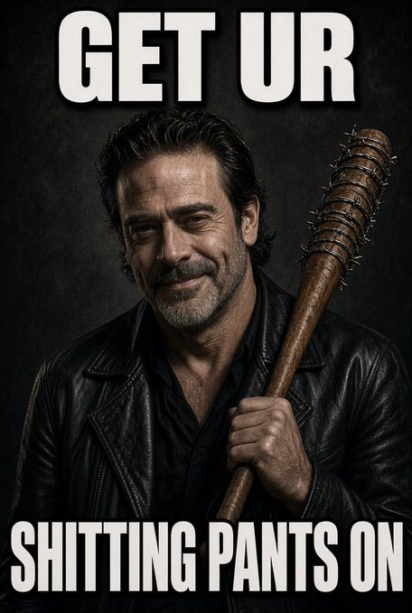 A man with dark hair and a beard, wearing a black leather jacket, holds a barbed-wire-wrapped baseball bat (Negan's weapon from "The Walking Dead"). The image features bold white text reading "GET UR" at the top and "SHITTING PANTS ON" at the bottom, visually menacing its target.

The meme pairs threatening imagery with a post contrasting low JPMorgan savings interest (~$1) against Coinbase's USDC yield (~$350), framing traditional banks as the ones who should fear competition, not crypto.