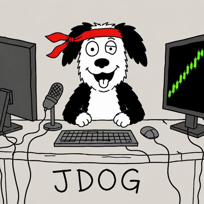 A cartoon illustration of a black and white dog wearing a red headband sitting at a desk with a microphone, keyboard, and dual monitors, one showing a green upward candlestick chart, with "JDOG" written on the desk.