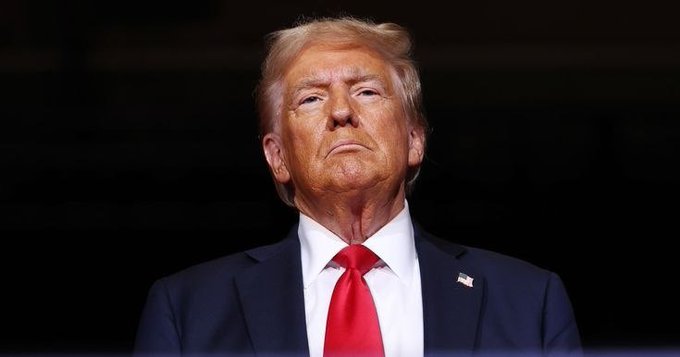 President Trump is shown in this image, looking stoic and serious, mirroring the gravity of his statement regarding the "OVER" memorandum of understanding with Iran.