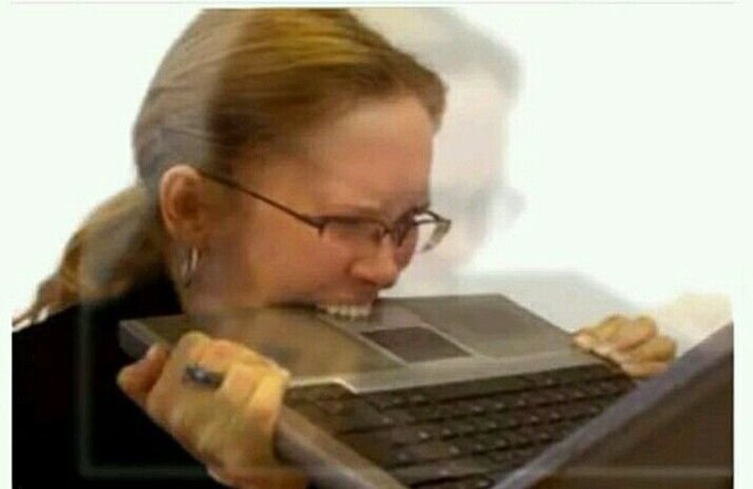 The image shows a woman holding an open laptop computer with her mouth wide open, as if she's about to take a bite out of it or play with it. The caption reads "solana holder vs hyperliquid holder". This suggests that there might be some confusion or humor in the context of the image and its caption.