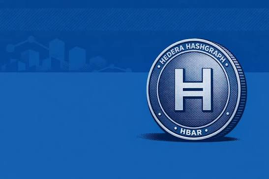 A promotional graphic featuring a large metallic coin labeled "HEDERA HASHGRAPH" and "HBAR" against a blue background with subtle city silhouettes.