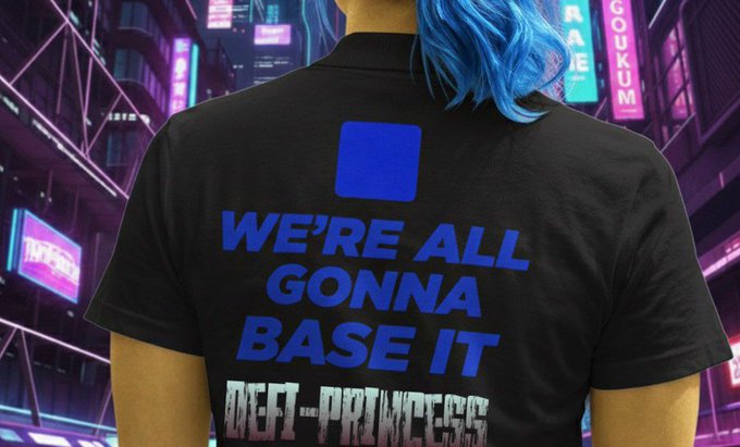 A person with blue hair wearing a black t-shirt with blue text reading 'WE'RE ALL GONNA BASE IT' and 'DEFI-PRINCESS' against a neon cyberpunk cityscape background with signs including 'COGNIUM'.