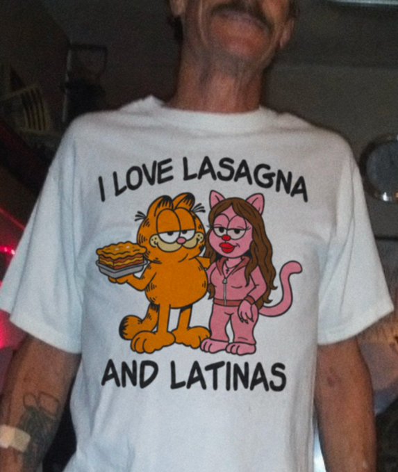 A man wearing a white t-shirt featuring Garfield holding lasagna next to a female cat character, with the text 'I LOVE LASAGNA AND LATINAS'.