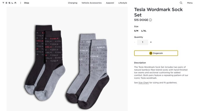 A screenshot of Tesla's online shop displays the "Tesla Wordmark Sock Set" priced at $15 DOGE, showing two pairs of black and gray bamboo fiber-blend socks with the Tesla logo pattern—memorializing the brief period when Tesla accepted Dogecoin payments for merchandise, including this apparel set.