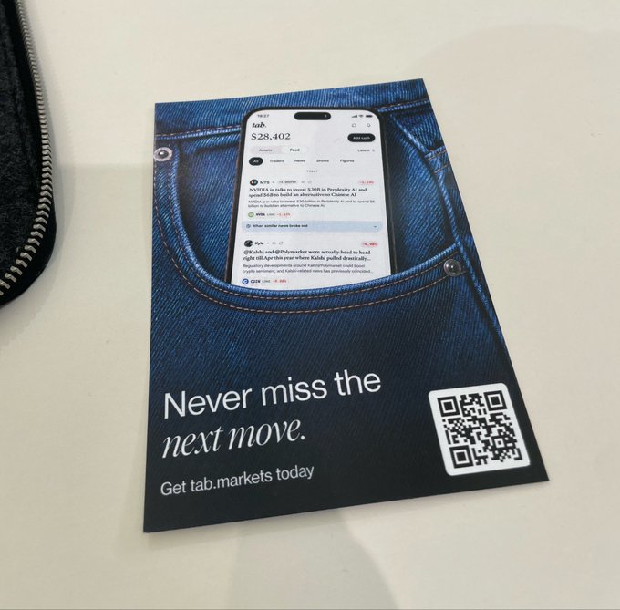 A promotional card designed to look like a denim jean pocket displays a phone screen showing "tab. $28,402" stock feed, with the text "Never miss the next move. Get tab.markets today" and a QR code.