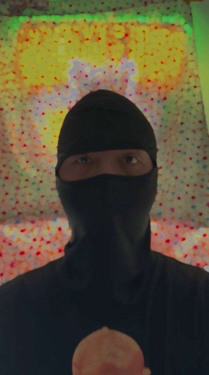 The image features a person wearing a black mask, possibly a ninja or a superhero, with their face obscured by the mask. They are holding an ice cream cone, which adds a playful element to the scene. The background of the image consists of a colorful patterned wall that contrasts with the dark mask and the ice cream cone.

The caption for this image reads: "Let' s make @mamebnb shine brighter than ever! GMame!".