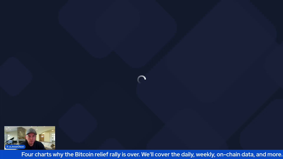 A man wearing a cap and glasses is sitting down with his laptop computer, actively watching or interacting with a video on his screen. The video displays a square window filled with various images against a dark blue background, which seems to discuss Bitcoin. It appears that the viewer of this video has been reading about the current value of Bitcoin, specifically at $6,000 per coin.