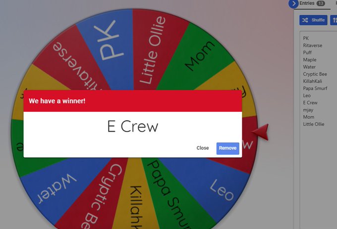 A screenshot of a spinning wheel app with names on the segments, showing a pop-up that says "We have a winner! E Crew".