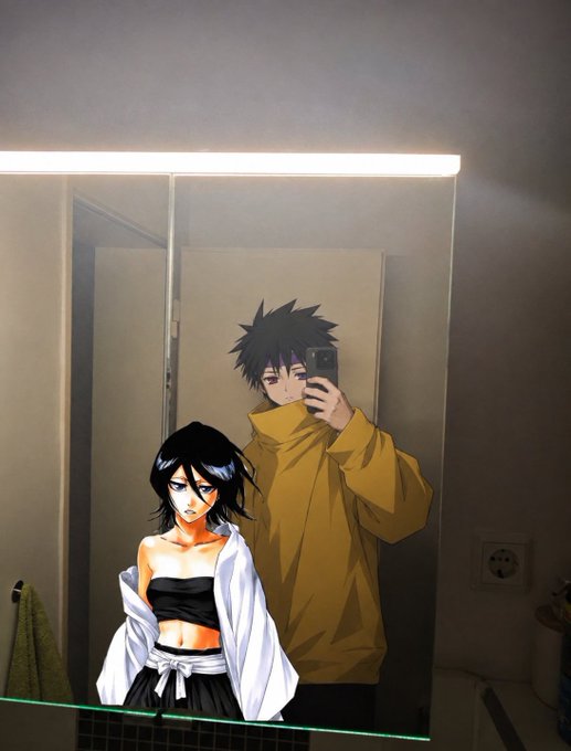A mirror selfie photo featuring a person in a yellow hoodie holding a phone, with an overlaid anime character of a dark-haired woman in a black outfit next to them.