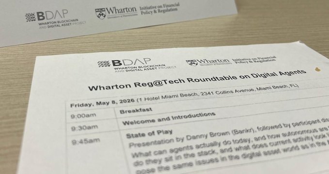 The image shows a white piece of paper with black text, which appears to be a schedule or agenda for an event. The text includes details about the event, such as the date, time, location, and names of speakers. There are also mentions of "Wharton Reg@Tech Roundtable on Digital Agents" and "onchain will replace payment rails & base". This suggests that the image is related to a conference or meeting involving digital agents and payments in the technology industry.