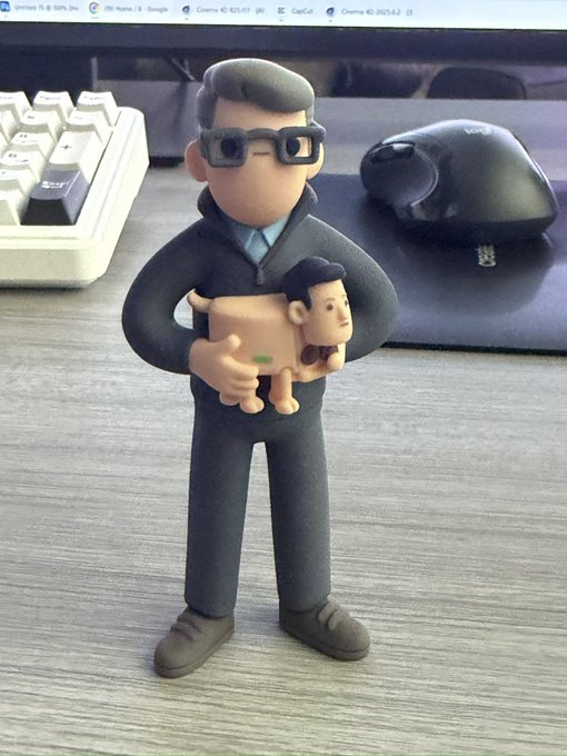 A small vinyl figure of Beeple, the digital artist known for creating daily crypto-themed artworks, stands on a desk wearing his signature glasses and holding a small character. The post references how the figure resembles his iconic Doodle art style, making it a delightful collector's item for fans of his work.