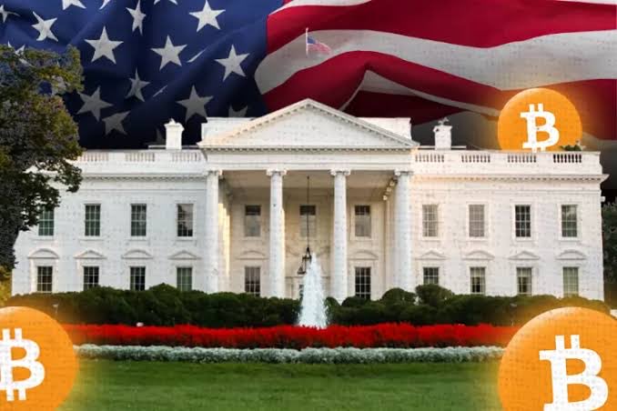 The White House is shown with an American flag waving behind it, overlaid with several glowing Bitcoin symbols.