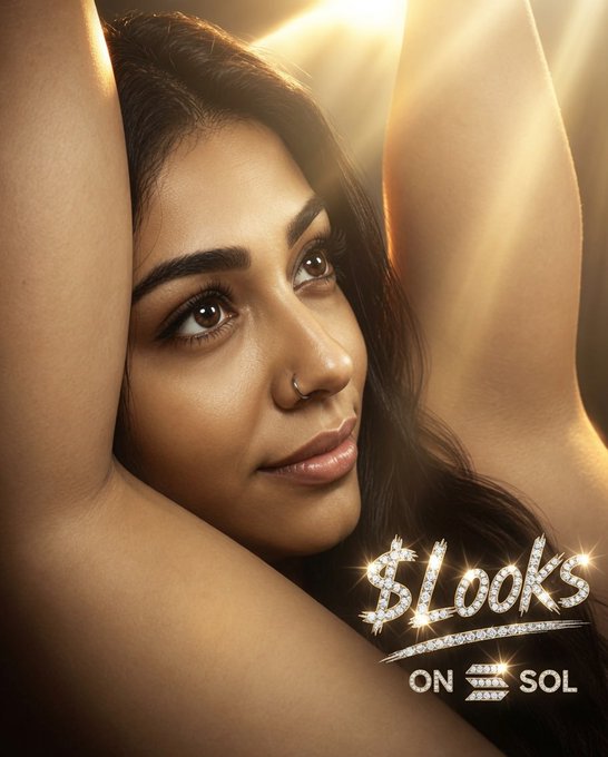 A glamorous beauty advertisement featuring a woman with raised arms and a nose piercing, with sparkly text reading '$Looks ON $SOL' in the bottom right corner.