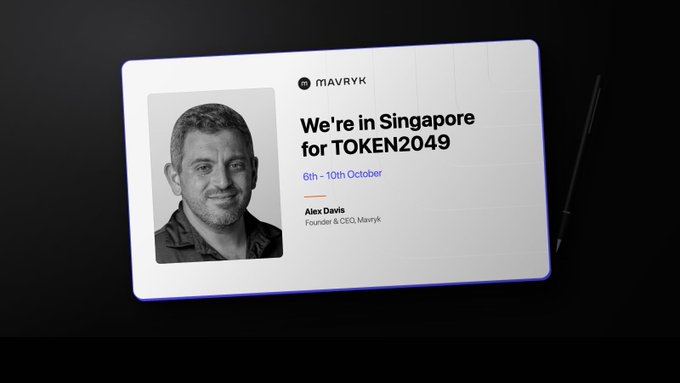 A mockup of a MavrYk promotional card announcing their presence in Singapore for TOKEN2049 from 6th-10th October, featuring a black-and-white portrait of founder and CEO Alex Davis.