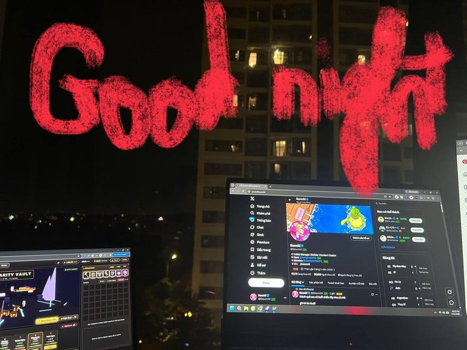A nighttime view of dual monitor screens displaying crypto/gambling websites with a tall building visible in the background, overlaid with 'Good night' written in red, blood-splatter style text.