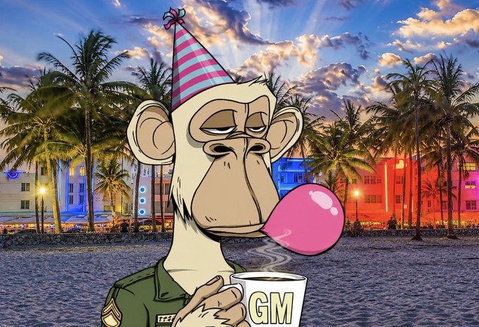 A cartoon monkey wearing a pink party hat blows a large pink bubblegum bubble while holding a steaming white mug labeled 'GM', set against a tropical sunset beach scene.