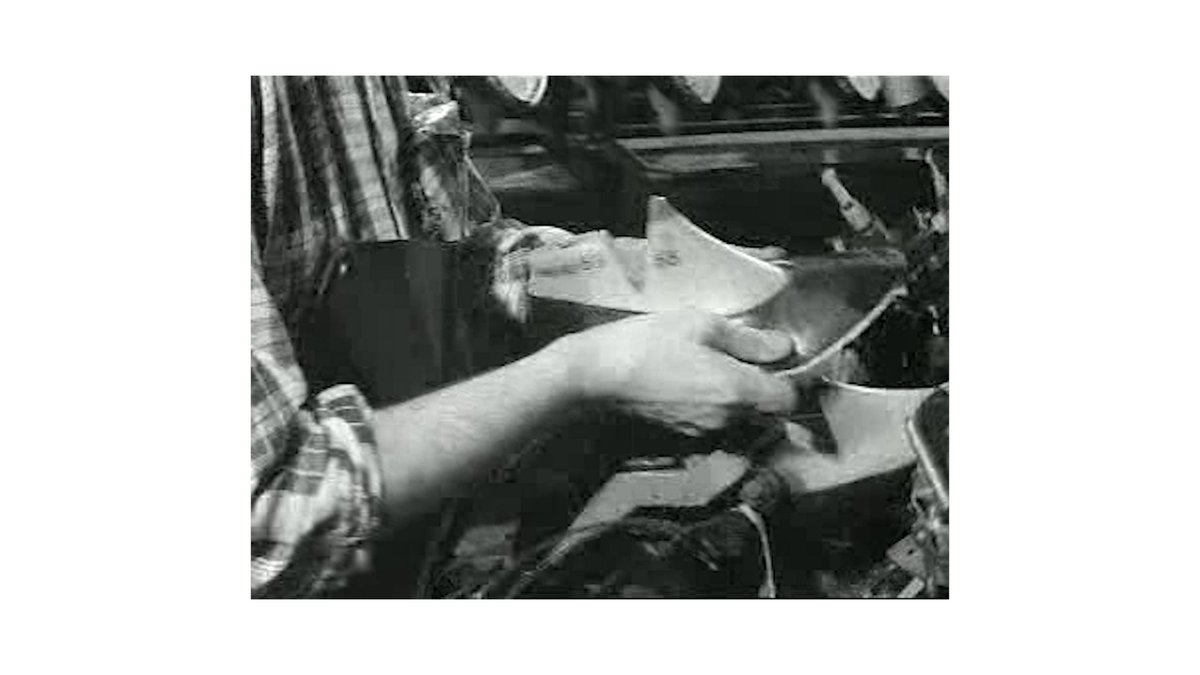 A craftsman's hands are shown shaping or signing a piece of leather at a workbench, likely a wallet in production. The image ties into the post by illustrating the artisanal, meticulous craftsmanship behind the Ledger Wallet brand, contrasting traditional handcraft with the modern message that each generation builds beyond what was previously imagined.