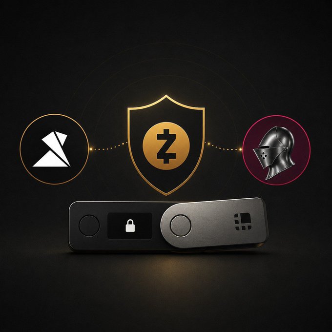 Promotional graphic showing a hardware wallet device beneath a gold shield with a 'Z' symbol, flanked by icons of a white origami bird and a knight's helmet.