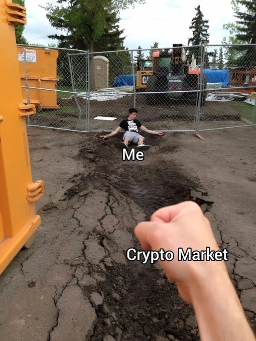 A meme showing a person labeled 'Me' getting ready to fight a fist labeled 'Crypto Market' on a cracked dirt construction site.