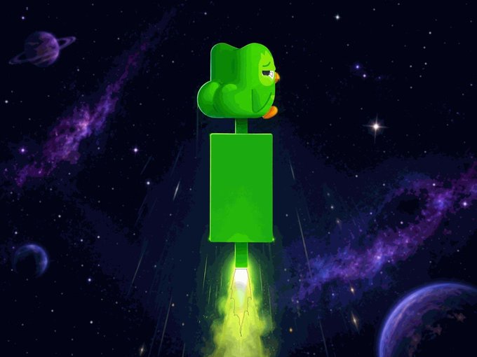 An animated illustration shows Duolingo's green owl mascot riding a rocket through space, with planets and stars in the background.