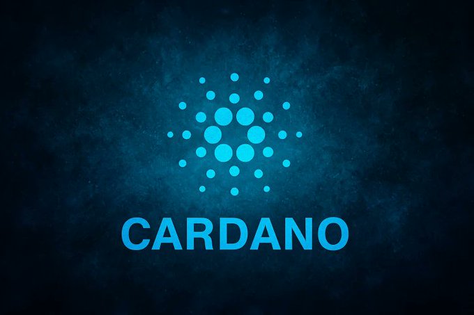 The image features a logo for Cardano, which is blue with white dots arranged in a circular pattern. The logo is set against a dark blue background that gives it an artistic touch. Below the logo, there's text that reads "decentralization at its finest $ADA". This combination of elements creates a visually appealing and cohesive design.