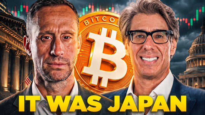 The image is a YouTube thumbnail featuring two men in suits flanking a large golden Bitcoin coin at its center, with the word "BITCOIN" displayed at the top and bold yellow text reading "IT WAS JAPAN" at the bottom. The background showcases financial imagery including candlestick charts, classical government-style architecture with columns, and a domed building, all under a dramatic cloudy sky. The thumbnail relates to the accompanying post by promoting a live discussion about Bitcoin having already bottomed, with the "IT WAS JAPAN" text teasing the episode's revelation that Japan—likely referencing the Japanese carry trade—was a key factor in Bitcoin's price movements.