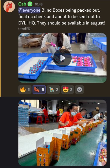 A Discord message from user 'Cab' showing images of a factory setting where workers are packing colorful items and yellow boxes, with the message 'Blind Boxes being packed out, final qc check and about to be sent out to DYLI HQ. They should be available in august!'.