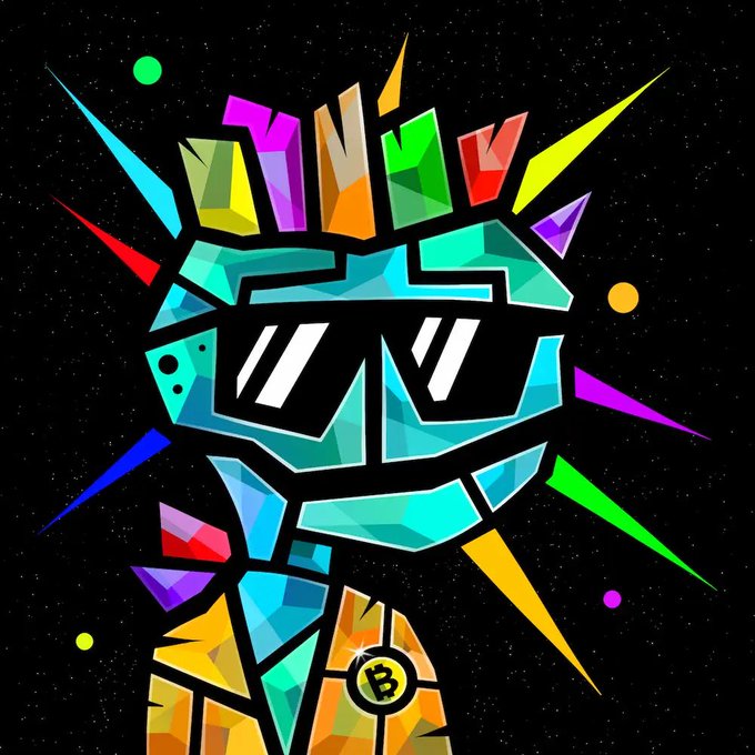 A colorful mosaic-style digital artwork features a stylized character wearing large sunglasses with a Bitcoin (₿) logo medallion on its chest, set against a black starry background with rainbow-colored geometric shards radiating outward and small green and orange dots.