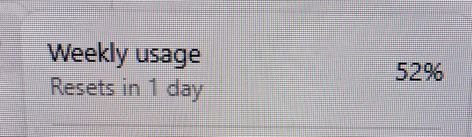 A phone or device screen shows 'Weekly usage Resets in 1 day' with '52%' displayed on a pixelated gray background.
