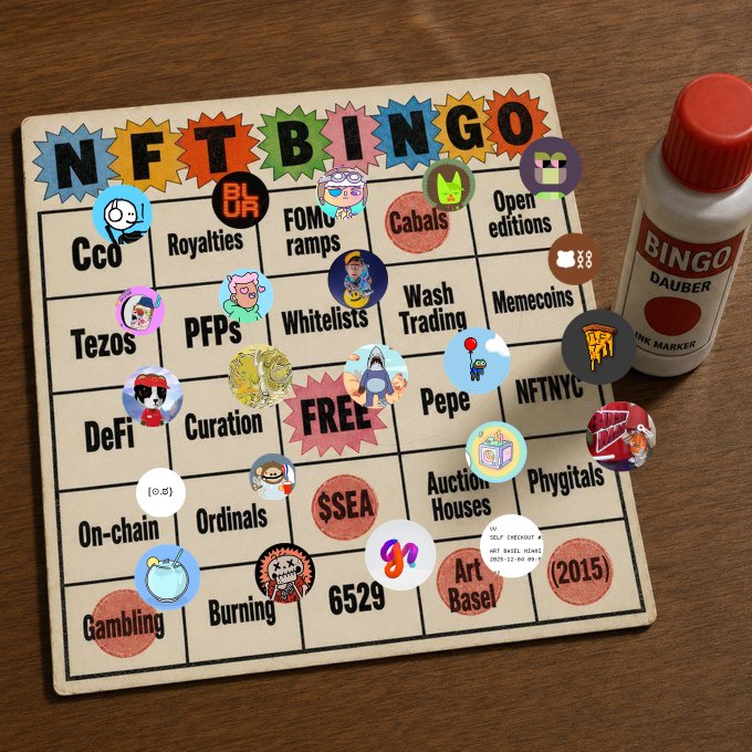 A 'NFT BINGO' card on a wooden table next to a 'BINGO DAUBER INK MARKER', featuring NFT-related terms like 'Tezos', 'PFPs', 'Whitelists', 'Curation', 'Ordinals', 'Burning', '6529', 'Art Basel', and 'Phygitals' covered with various character tokens.