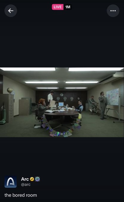 The image shows a group of people gathered around a table in an office setting. The room appears to be a conference room with a large desk and chairs arranged for a meeting or presentation. There are at least six people visible, some standing while others sit on chairs placed around the table. A TV screen is mounted on one wall, likely used for presentations or meetings. 

The image also contains text that reads "Over 1 million people today tuned in to watch 'the bored room'". This suggests that there was a significant amount of interest in watching this particular event or gathering. The caption further elaborates on the content of the image and how it relates to the post, providing additional context for viewers who may be interested in attending similar events or learning more about the topic being discussed.