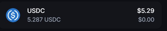 A cryptocurrency wallet interface showing a USDC balance of 5.287 USDC, valued at $5.29, with $0.00 change.