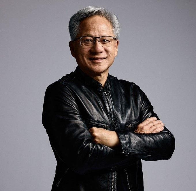 Nvidia CEO Jensen Huang, wearing his signature black leather jacket, is pictured in this portrait. The image relates to the post about his stance that Chinese open-source AI models should not be banned in the U.S.