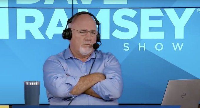 A man with headphones and a serious expression sits with crossed arms in front of a backdrop reading "THE DAVE RAMSEY SHOW," with a tumbler and laptop on the desk before him. The image pairs with a meme jokingly framing the scene as a Dave Ramsey call-in interview, where "Coinbase Man" admits to repeatedly getting burned by chasing Brian Armstrong's profile picture changes.