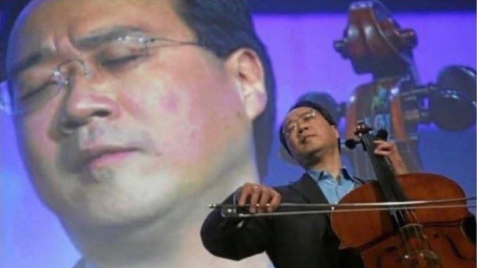 Cellist Yo-Yo Ma plays his instrument on stage, superimposed over a close-up image of a man's face with closed eyes.
