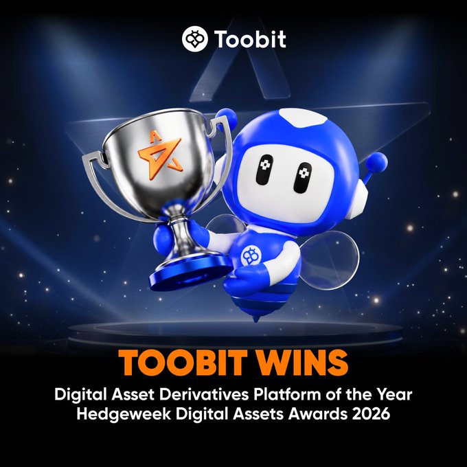 The image features a trophy with a blue and white design, held aloft by a robot character that appears to be a bee. The text at the bottom of the image reads "Toobit wins Digital Asset Derivatives Platform of the Year at the Hedgeweek Digital Assets Awards 2016". This suggests that Toobit has been recognized for their achievement in creating a digital asset platform, and they have won an award for it.