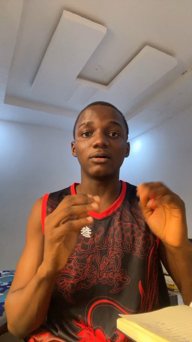 This video features a young man questioning if NFTs are making a comeback, while gesturing with his hands and wearing a tank top with a design that could be interpreted as dragon-like.
