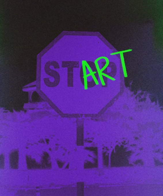 The image features a stop sign with the word "START" written above it, which is green in color. The background of the image is black, making the stop sign stand out prominently. There are no other objects or texts present in the image.
