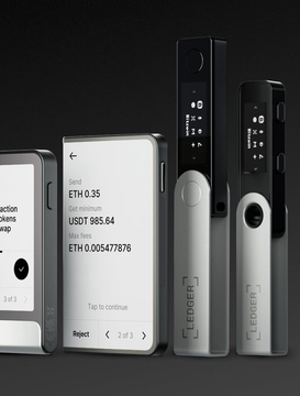 Two Ledger hardware wallets are displayed alongside a smartphone showing an Ethereum transaction screen with "ETH 0.35" and a USD value of "$985.64" at an address ending in "005477876," directly connecting to reports that compromised Ledger devices have been prompting users to send cryptocurrency transactions, likely leading to the retailer's pause on sales.