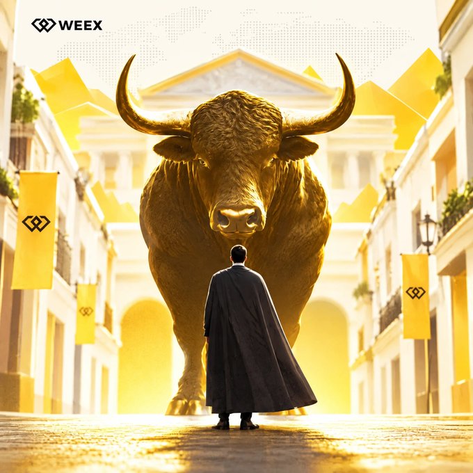 A person in a black cloak stands before a massive golden bull statue in a sunlit classical street, with "WEEX" branding and logos displayed on yellow banners—visually embodying the bullish sentiment of the post "Still Feel Bullish! React if you agree."