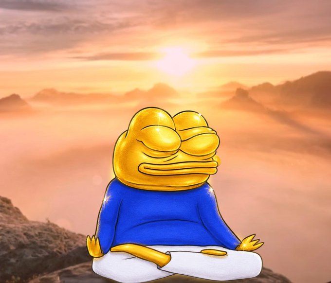 A cartoon golden frog character in a blue shirt meditates in a lotus position on a mountain peak at sunset, surrounded by clouds.